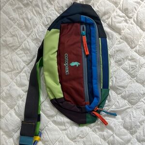 Cotopaxi Red and Green Belt Bag for Outdoor Adventures